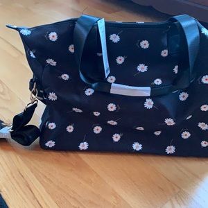 NWT Alice + Olivia duffel.  Black with daisies.